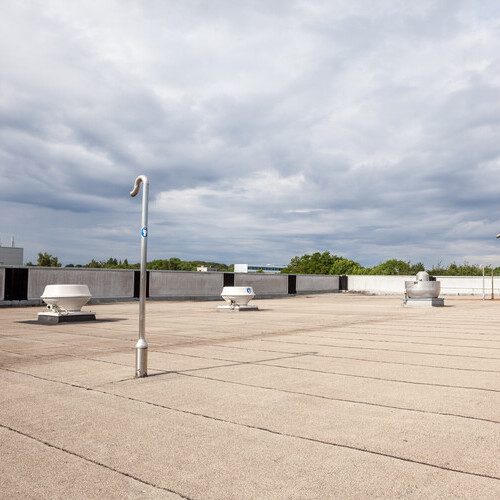 view of a building's flat roofing system